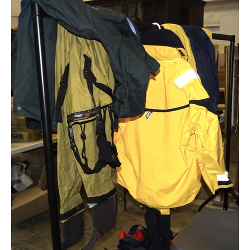 74 - A quantity of fishing clothing and equipment, including chest waders, Patagonia jacket, vacuum rod r... 