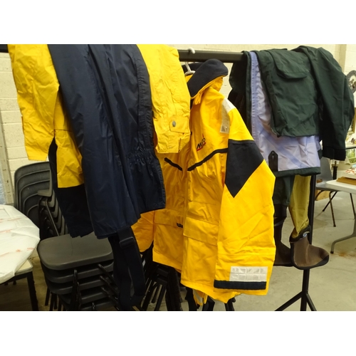 74 - A quantity of fishing clothing and equipment, including chest waders, Patagonia jacket, vacuum rod r... 