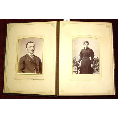 80 - A late-Victorian leather photograph album (a/f), with family photographs.