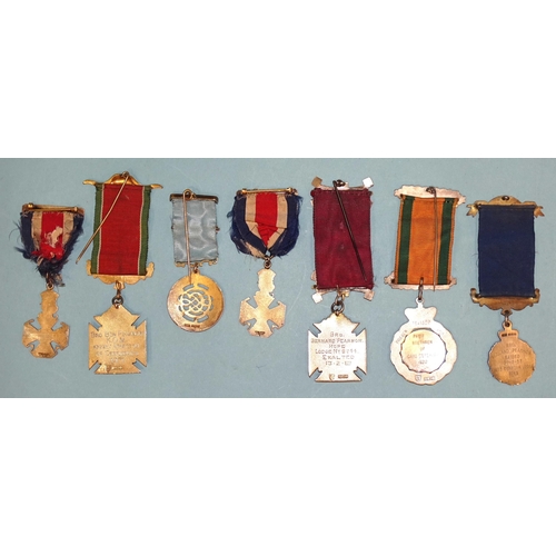 104 - A collection of Masonic jewels,  and regalia, including seven silver, together with a collection of ... 