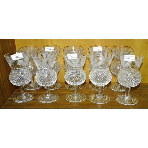 41 - Edinburgh Crystal, a set of nine etched thistle and hobnail-decorated wine glasses, 16.5cm high and ... 