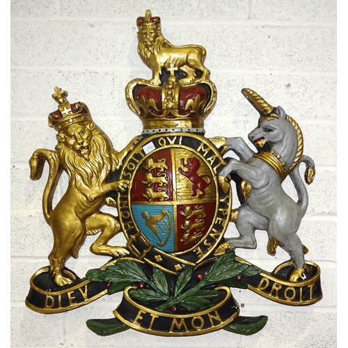 46 - A moulded plastic and painted royal coat of arms, 70 x 77cm.