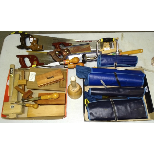 34 - A Disston D8 hand saw, other hand saws, a Stanley brace and bits, a collection of chisels and sharpe... 