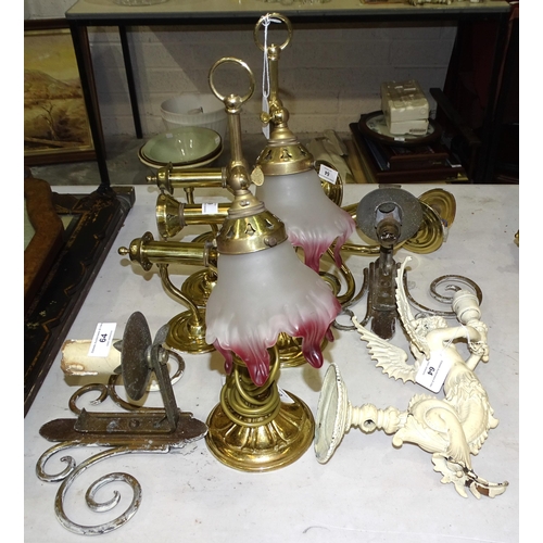 64 - A painted metal wall lamp holder in the form of a winged caryatid, a pair of modern brass desk lamps... 