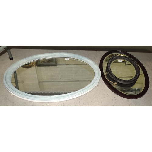 65 - A walnut arched hanging wall mirror and four other mirrors, (5).