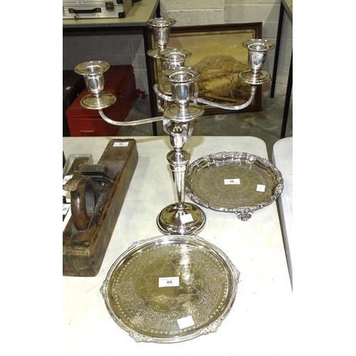 88 - A plated four-branch candelabrum, 39cm and two plated salvers, (3).