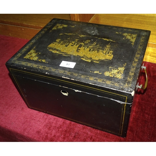 91 - A black lacquered box, the lid with chinoiserie decoration, the interior with three trays, brass sid... 