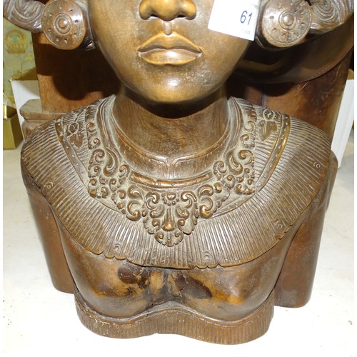 61 - An Asian carved bust of a woman wearing a headdress, 50cm high, a seated carved wood Oriental figure... 