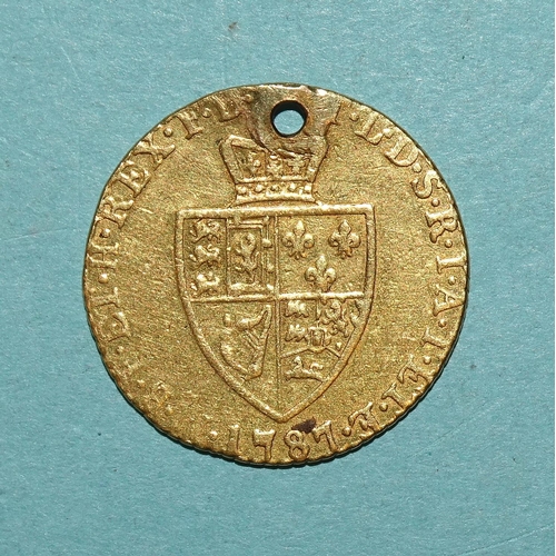 223 - A George III 1787 gold half-guinea, (holed), 4.1g.