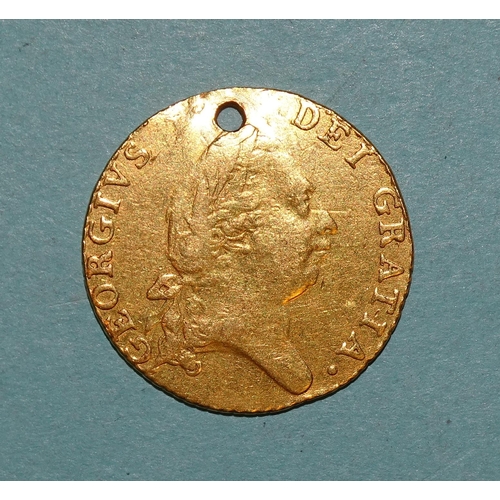 223 - A George III 1787 gold half-guinea, (holed), 4.1g.