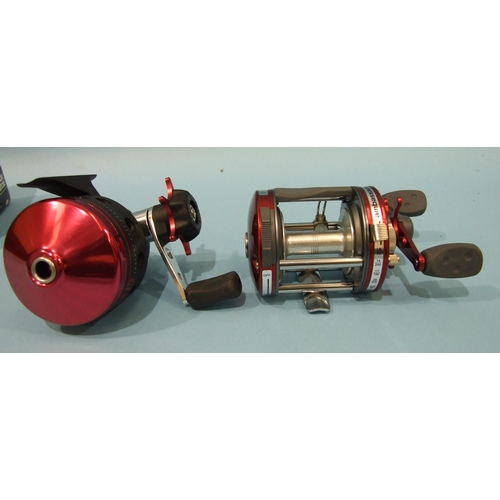 458 - An Abu Garcia Ambassador 6000 reel with instant anti-reverse, in red, in good unused condition and a... 