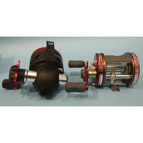 458 - An Abu Garcia Ambassador 6000 reel with instant anti-reverse, in red, in good unused condition and a... 