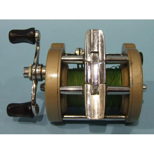 462 - J W Younge & Sons, the Gildex lever-wind reel with folding foot and finished gold, retained 90% ... 