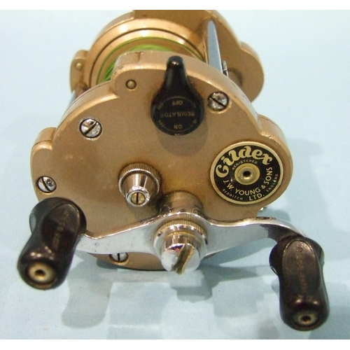 462 - J W Younge & Sons, the Gildex lever-wind reel with folding foot and finished gold, retained 90% ... 