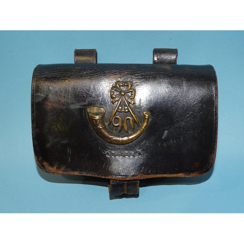 506 - A vintage black leather military belt pouch bearing the brass insignia for the 90th Regiment of Foot... 