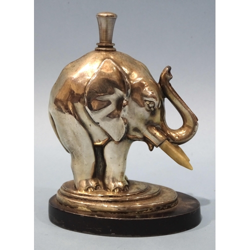 525 - A mid-20th century Ronson chrome-plated elephant touch-tip table lighter, with striker, on oval base... 