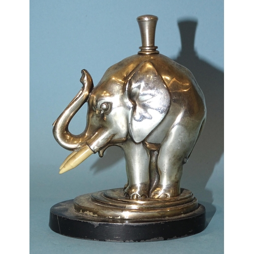 525 - A mid-20th century Ronson chrome-plated elephant touch-tip table lighter, with striker, on oval base... 