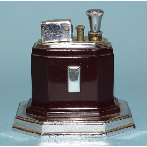 526 - A Ronson Art Deco touch-tip chrome and brown Bakelite table lighter, on octagonal base, 9cm high.... 