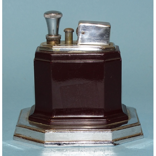 526 - A Ronson Art Deco touch-tip chrome and brown Bakelite table lighter, on octagonal base, 9cm high.... 