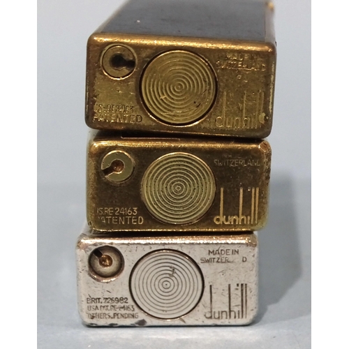 529 - A Dunhill slim silver-plated engine-turned lighter, a Dunhill gold-plated and mottled brown slim lig... 