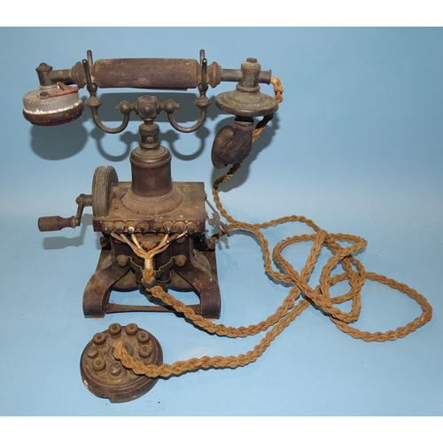 552 - An early-20th century skeleton-type hand-cranked telephone, probably made by Ericasson, marked no.16... 