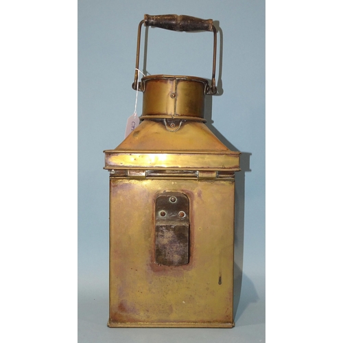 553 - Bulpitt & Sons, Birmingham, a brass bulkhead lamp dated 1914, 40cm high, (50cm high with handle ... 