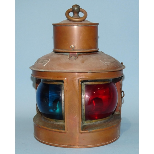 554 - A copper and brass port/starboard bow mast lamp with split red/green glass and sliding double-burner... 