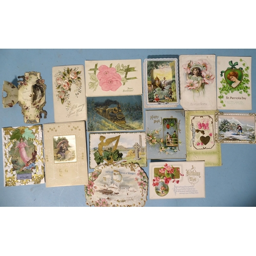 77 - A collection of fifteen Edwardian greetings cards from USA, Ireland and England, including one ornat... 