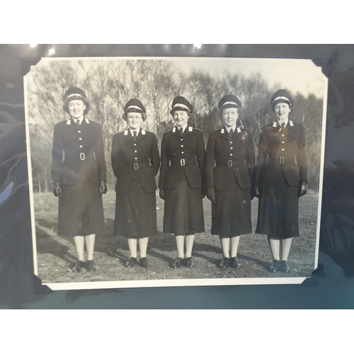 87 - An album of approximately 75 black and white photographs of women in uniform, mainly circa WWII.... 