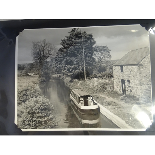 89 - Three albums containing approximately 144 black and white 17 x 22cm photographs of narrow boats and ... 