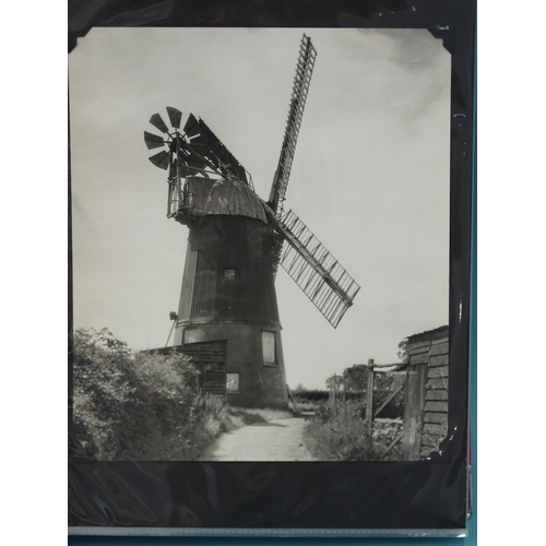 90 - An album of 47 black and white photographs of windmills and water wheels, approximately 23 x 20cm.... 