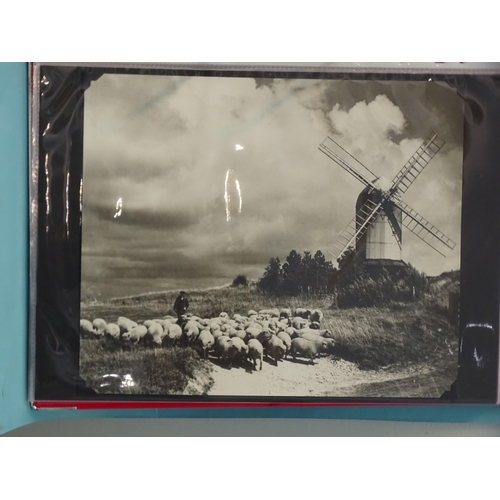 90 - An album of 47 black and white photographs of windmills and water wheels, approximately 23 x 20cm.... 