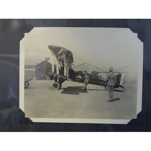 94 - An album of approximately 75 black and white photographs of aircraft, mainly during WWII and before,... 