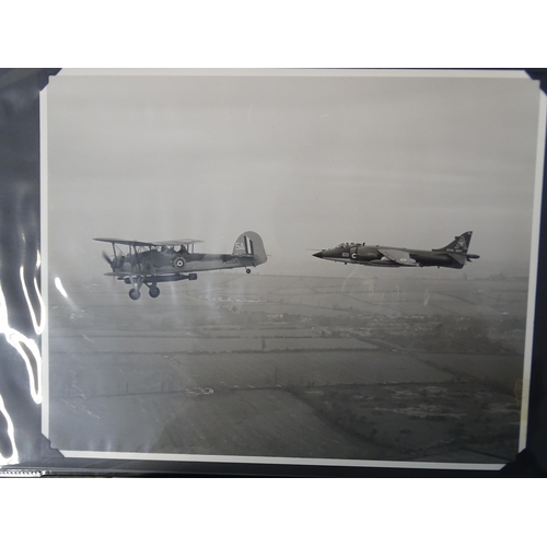 95 - An album of approximately 75 black and white photographs of aeronautical subjects, including refuell... 