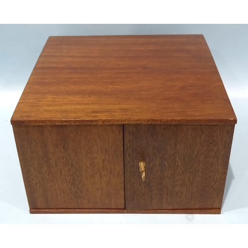 213 - A Peter Nichols 'Pheon II' mahogany coin collectors' cabinet, fitted with a pair of hinged doors ope... 