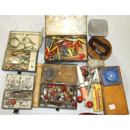 477 - A collection of lures and decoy minnows, an alloy cast tin and other fishing accessories.... 