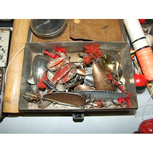 477 - A collection of lures and decoy minnows, an alloy cast tin and other fishing accessories.... 