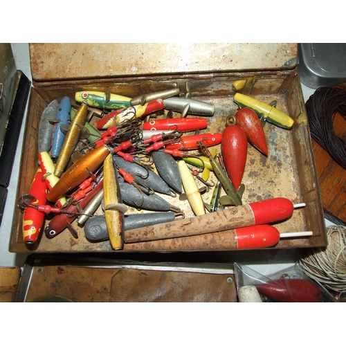 477 - A collection of lures and decoy minnows, an alloy cast tin and other fishing accessories.... 