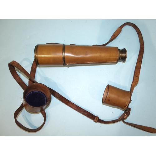 494 - A Broadhurst Clackson & Co. three-draw telescope with leather-covered grip, (dents to primary tu... 