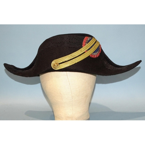 501 - A 19th century French military bicorn hat, in black with black silk brocade ribbon binding, gold bra... 