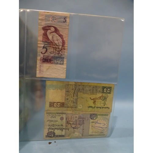 124 - A collection of various British and foreign bank notes contained in an album.