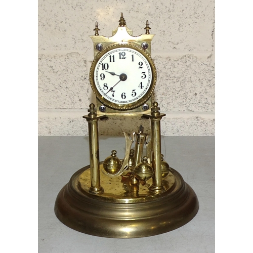 2 - A brass 400-day clock under a glass dome, on circular base, 30cm high overall.