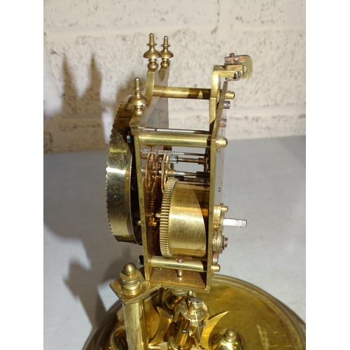 2 - A brass 400-day clock under a glass dome, on circular base, 30cm high overall.