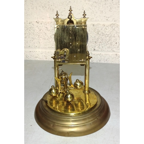 2 - A brass 400-day clock under a glass dome, on circular base, 30cm high overall.