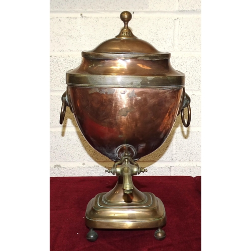 24 - A 19th century copper and brass-bound samovar with ring handles and patent tap, 47cm high.... 