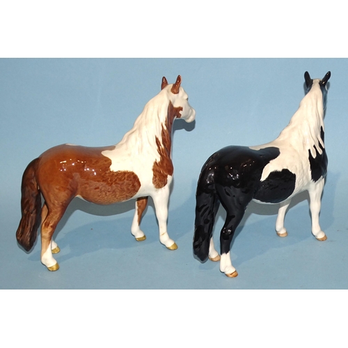 27 - A Beswick piebald pinto pony and a similar skewbald pony, (2nd versions), 16.5cm high, (2).... 