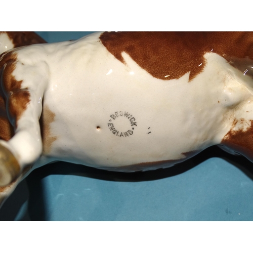 27 - A Beswick piebald pinto pony and a similar skewbald pony, (2nd versions), 16.5cm high, (2).... 