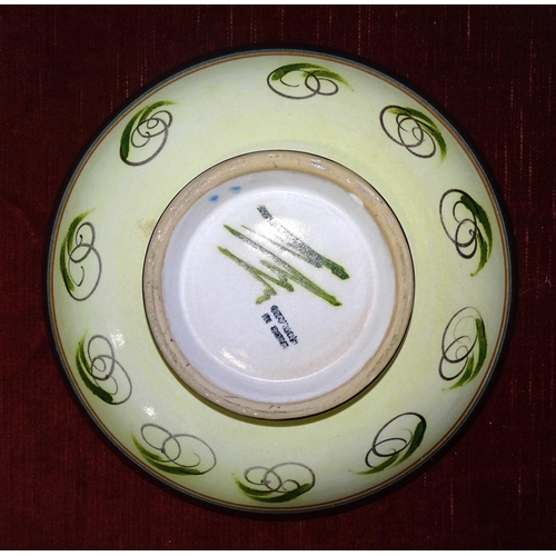 29 - A Glyn Colledge pottery bowl decorated with autumn leaves, with green monogram and 'Made in England'... 