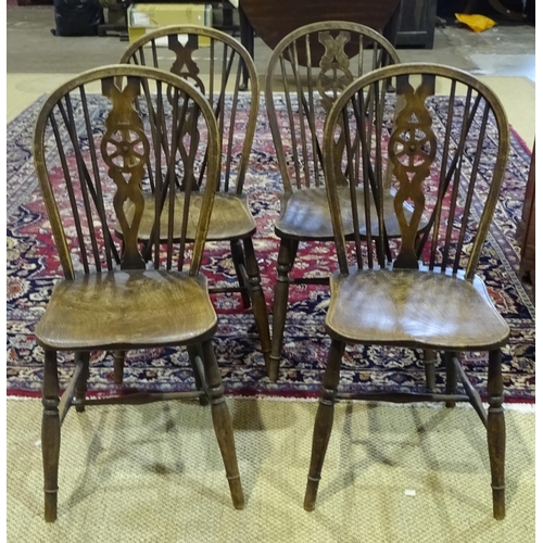 36 - A set of four stained beech and elm wheelback kitchen chairs, (4).