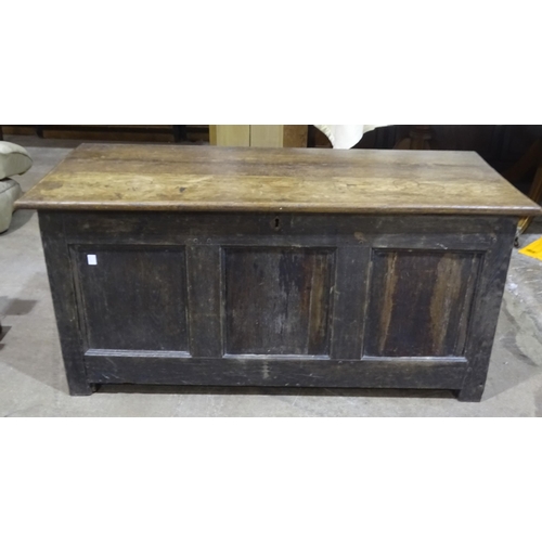 41 - An oak-lidded and panelled coffer, 127cm wide, 60cm high, a carved oak sideboard with panelled back ... 